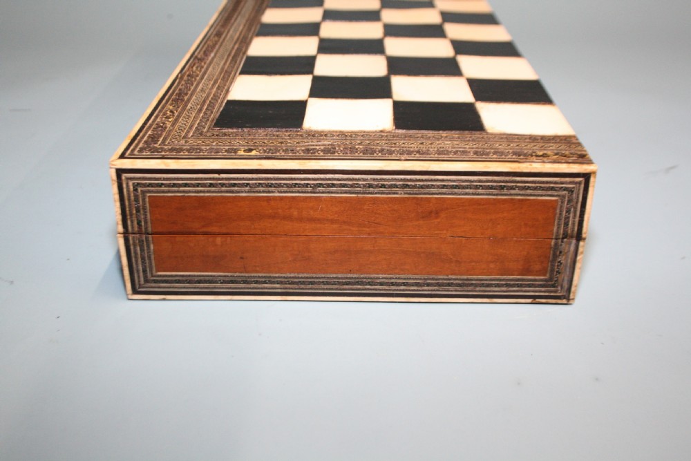19th century chess board in bone and ebony, with backgammon to the inside. View III