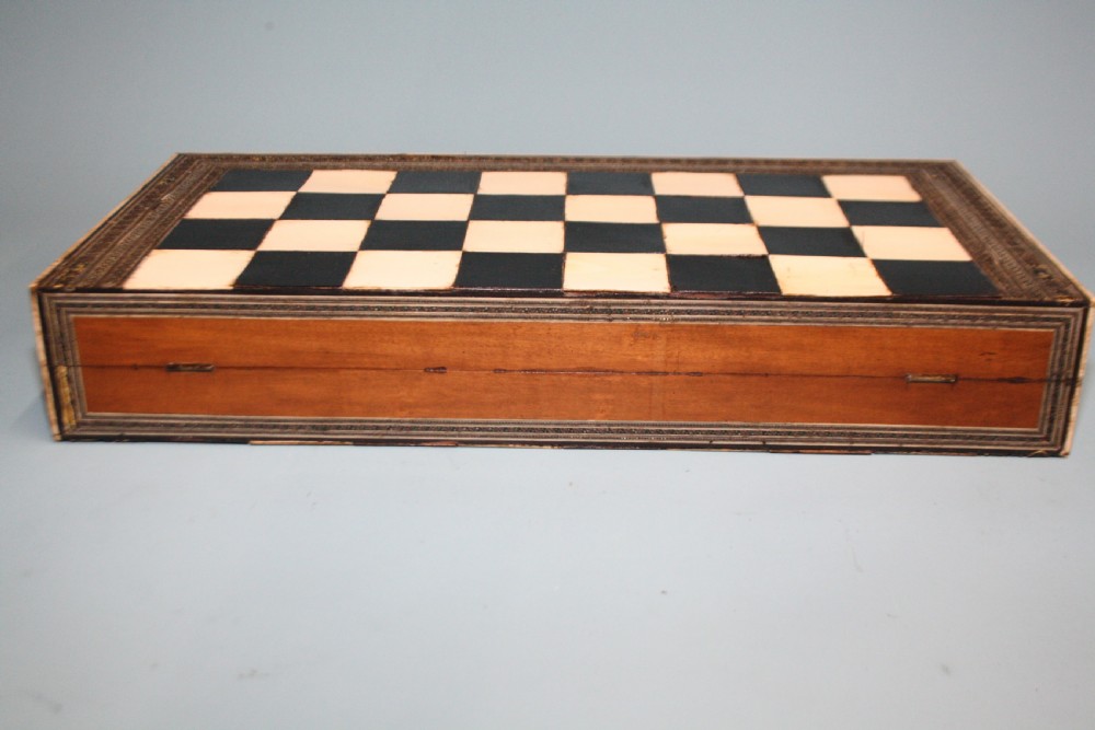 19th century chess board in bone and ebony, with backgammon to the inside. View V