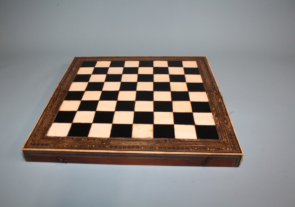 19th century chess board in bone and ebony, with backgammon to the inside. View VI
