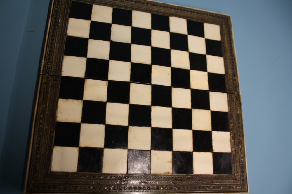 19th century chess board in bone and ebony, with backgammon to the inside. View XV