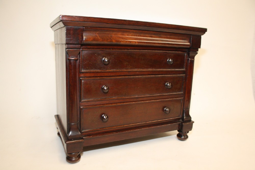 Late 19th century miniature chest of drawers with split bolsters View II
