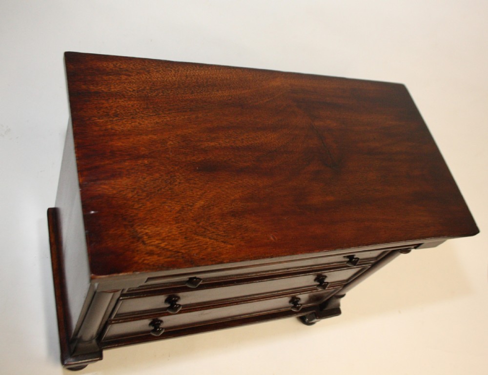 Late 19th century miniature chest of drawers with split bolsters View III