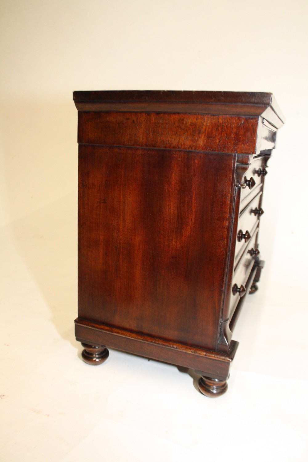 Late 19th century miniature chest of drawers with split bolsters View IV
