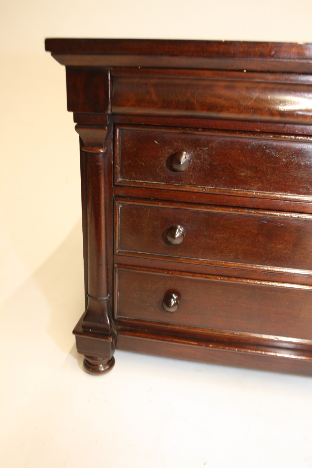 Late 19th century miniature chest of drawers with split bolsters View XI