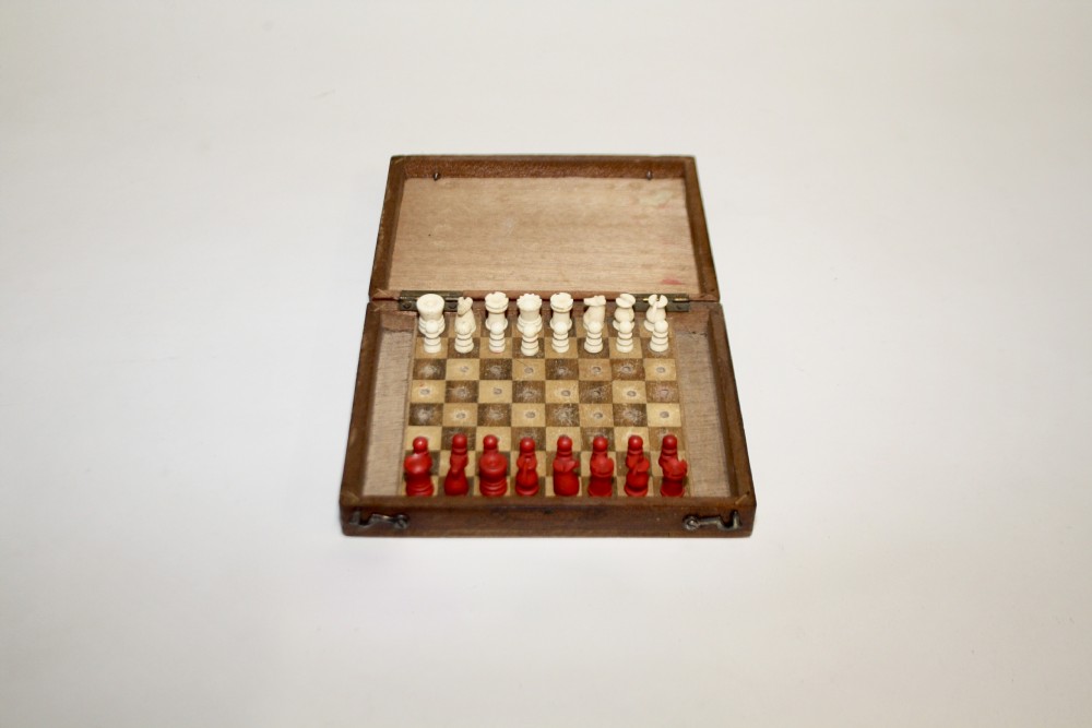 Early 20th century miniature travelling chess set