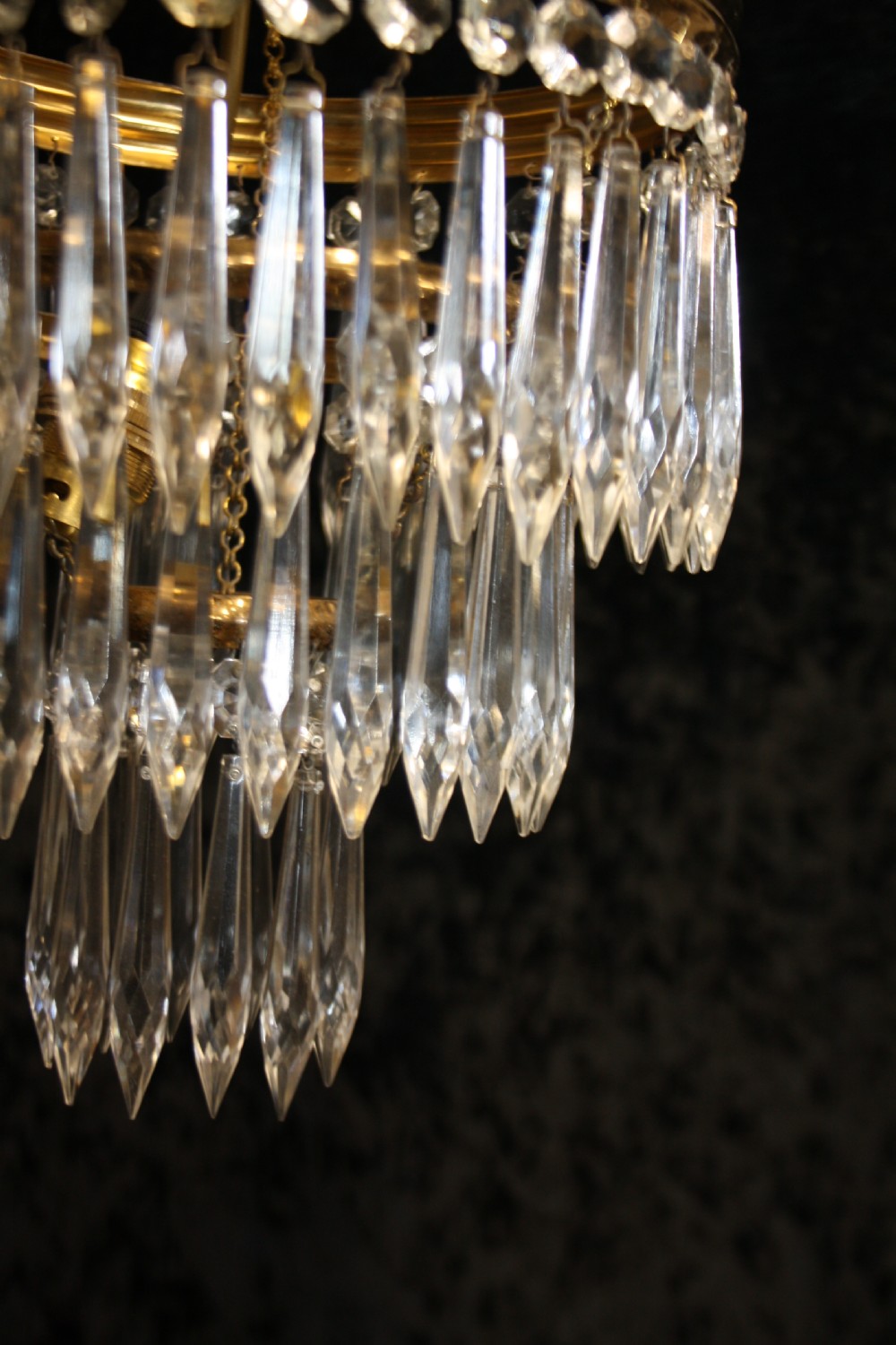 Pair of spike chandeliers with moulded brass rings View V