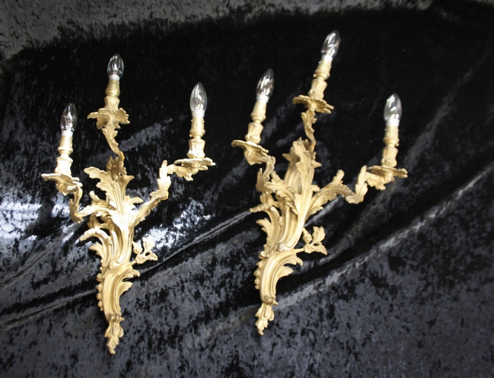 Pair of early 20th century gilt brass three arm wall lights