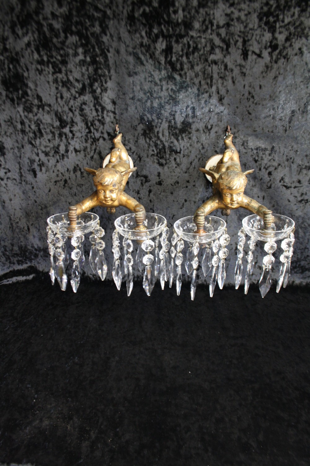 
Early 20th century pair of cherub wall lights