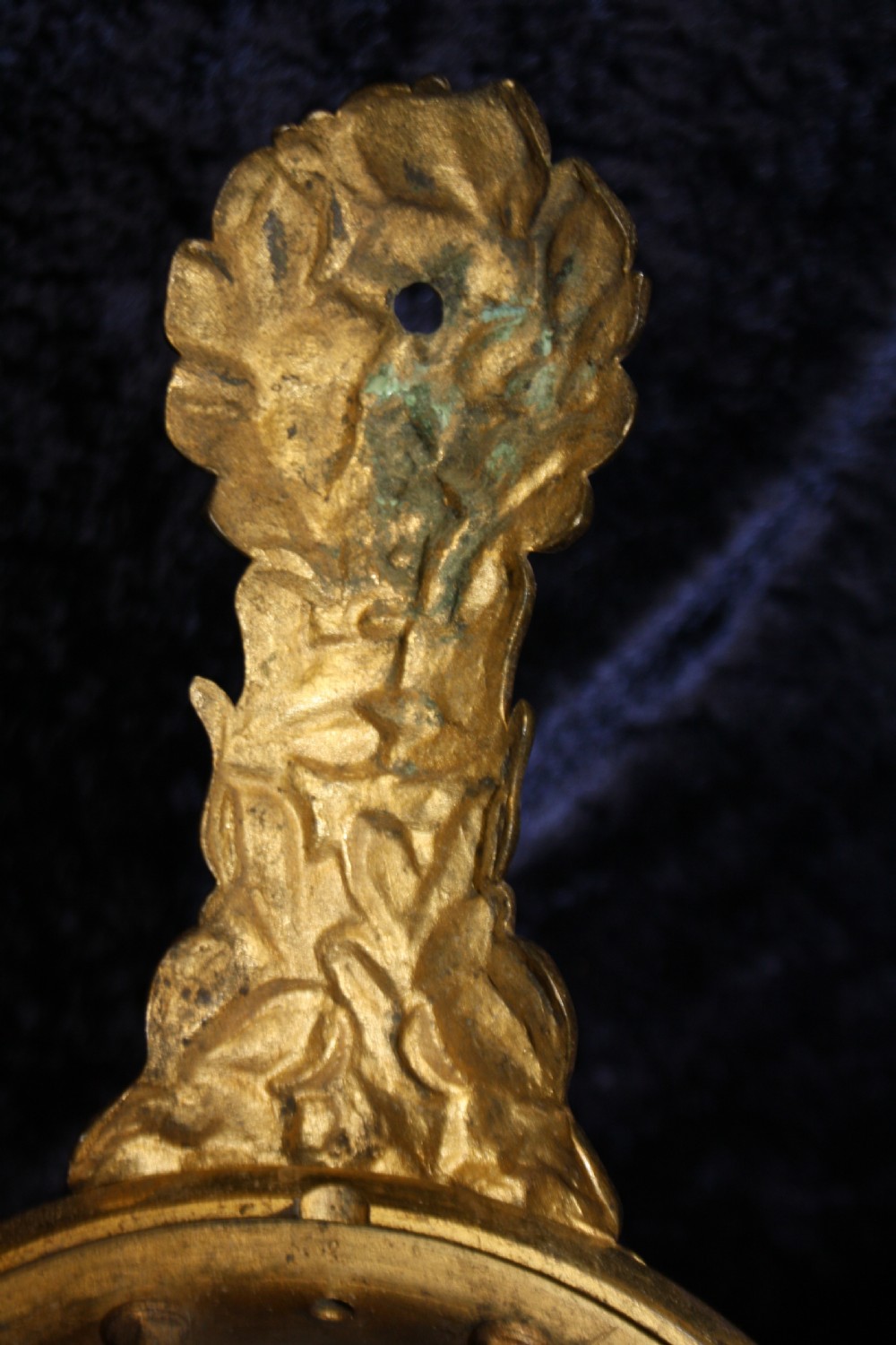 An ornate cast gilt brass ceiling rose featuring three foliate arms, grape and leaf motifs, and a central mounting hook. View II