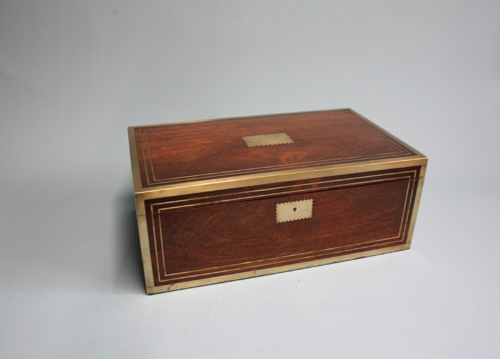 Regency rosewood writing slope with secret compartments.