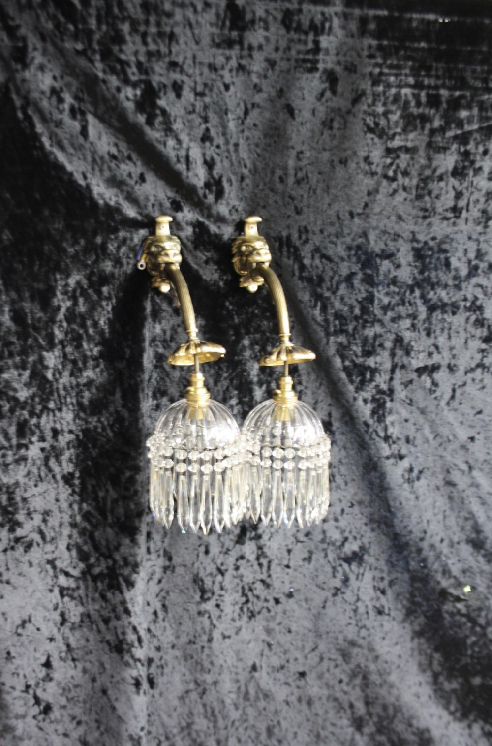 Pair of late 19th century lion and spike wall lights 