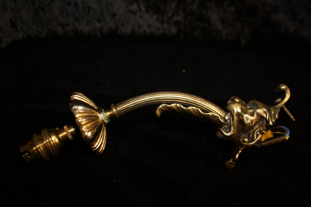 Pair of late 19th century lion and spike wall lights  View II