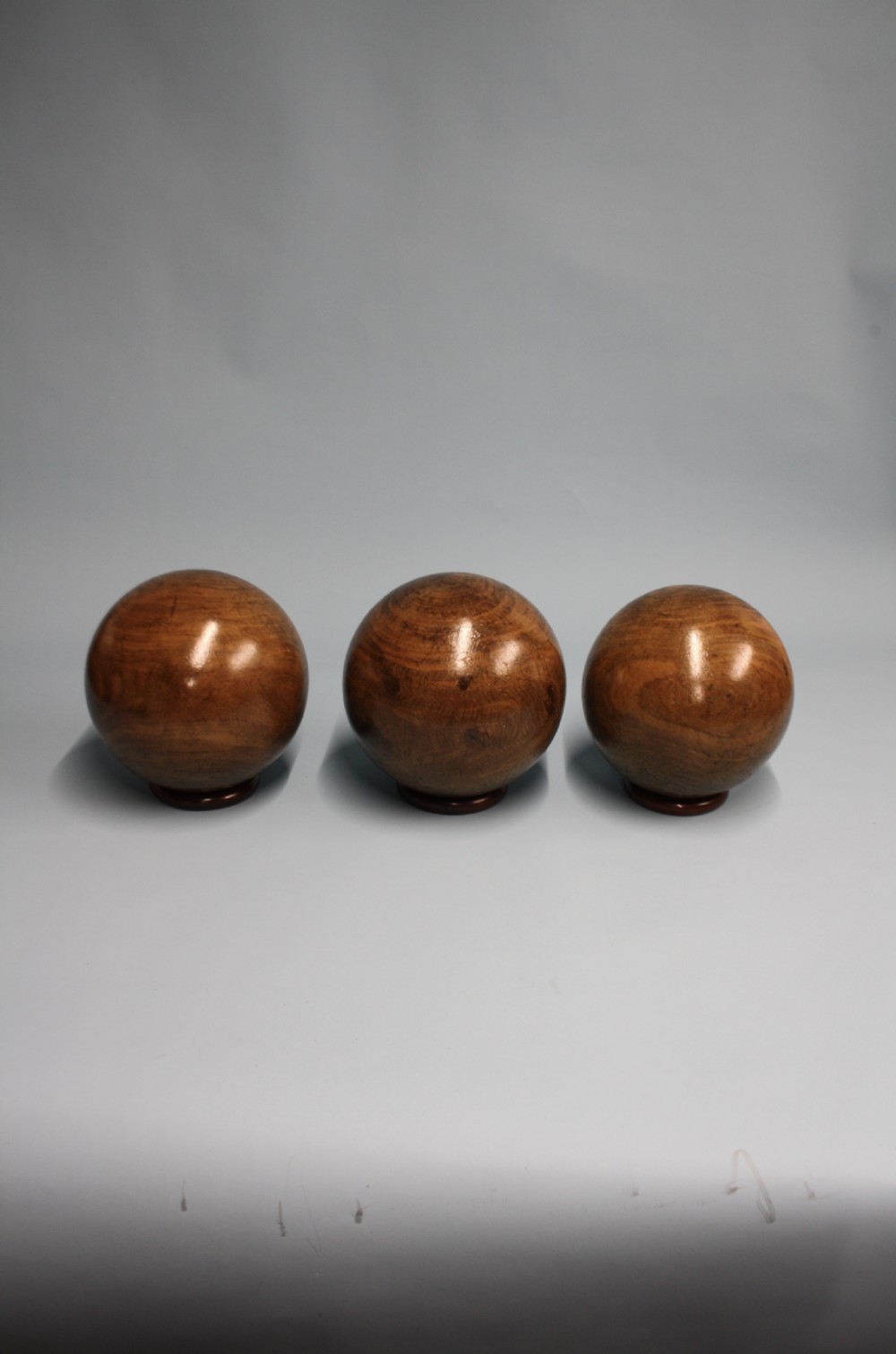 Three lignum vitae balls 8.5