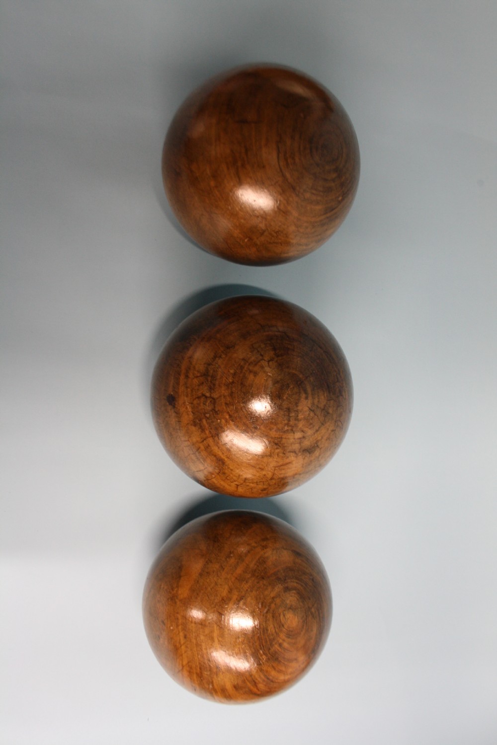 Three lignum vitae balls 8.5