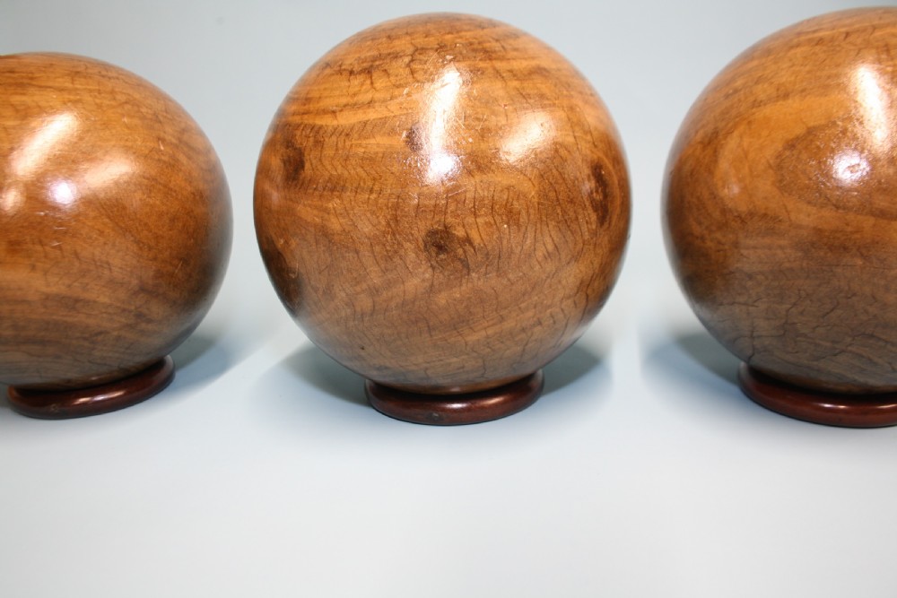 Three lignum vitae balls 8.5
