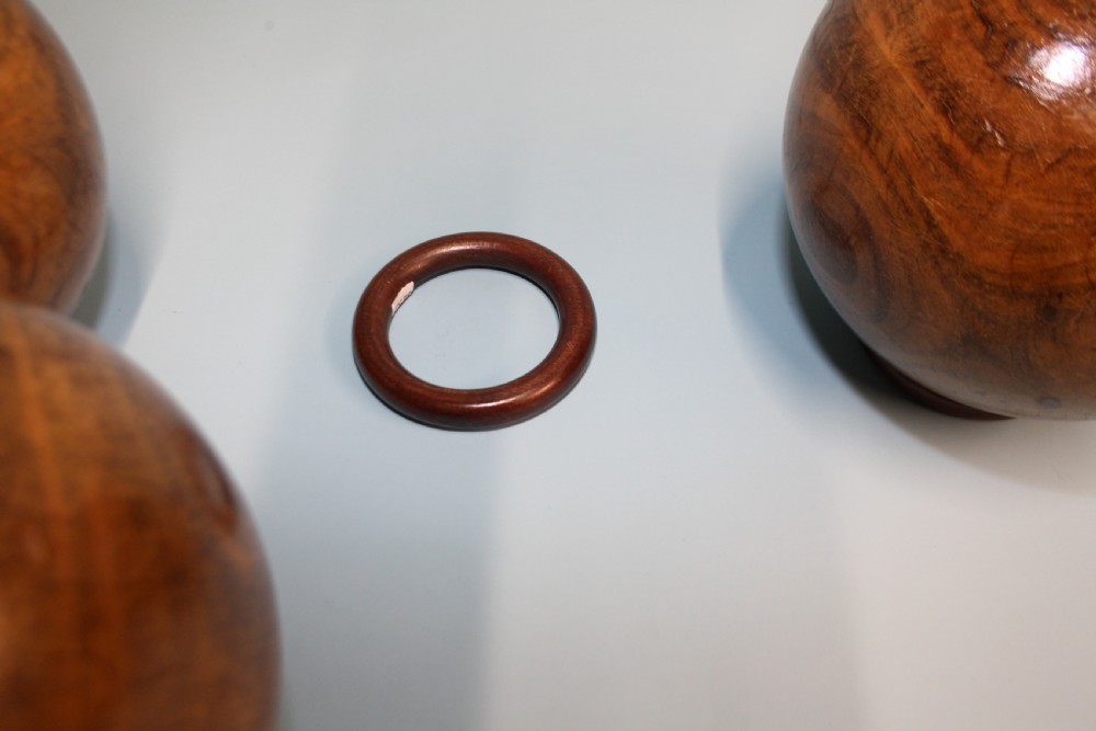 Three lignum vitae balls 8.5