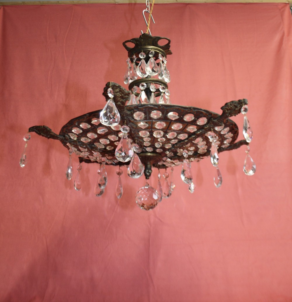 Brass chandelier with pierced brass base