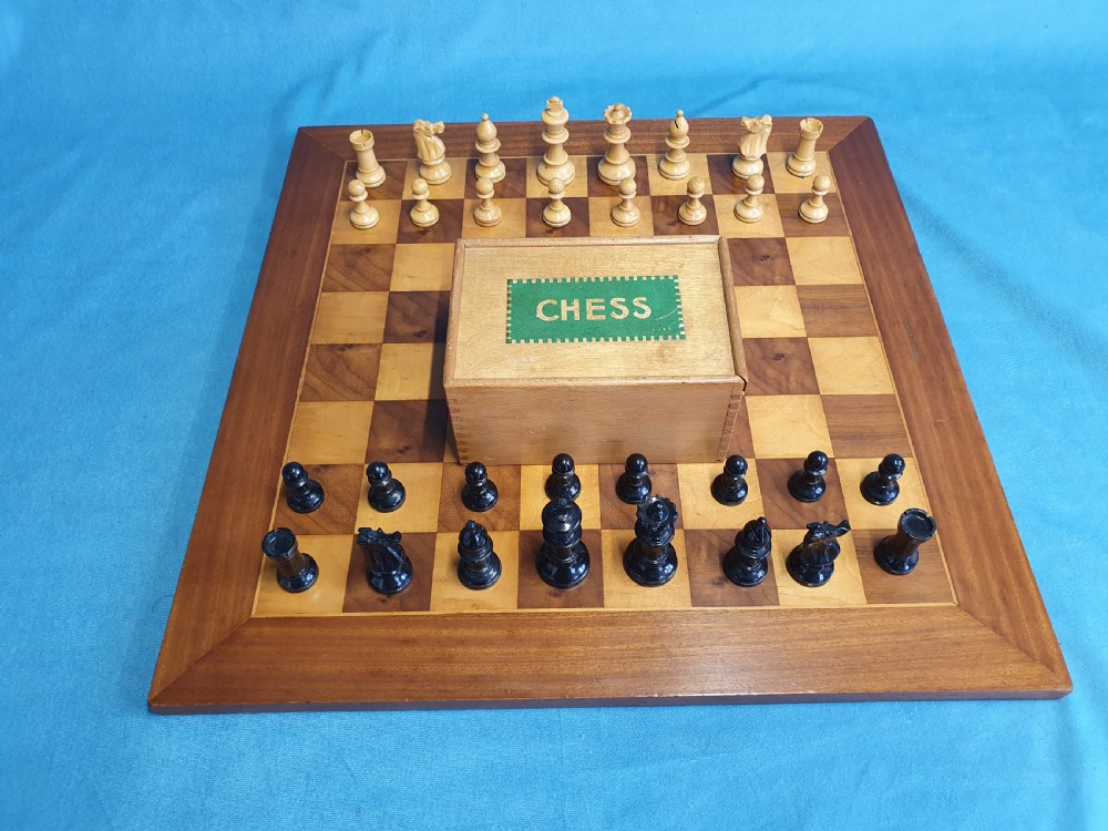 Early 20th century chess board made by Jacks of London with chess set View II
