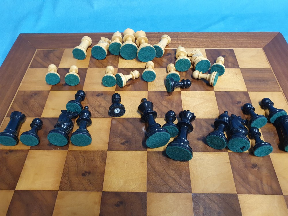 Early 20th century chess board made by Jacks of London with chess set View IV