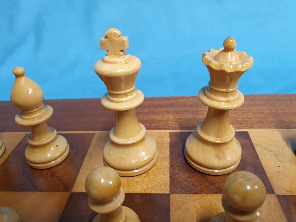 Early 20th century chess board made by Jacks of London with chess set View V