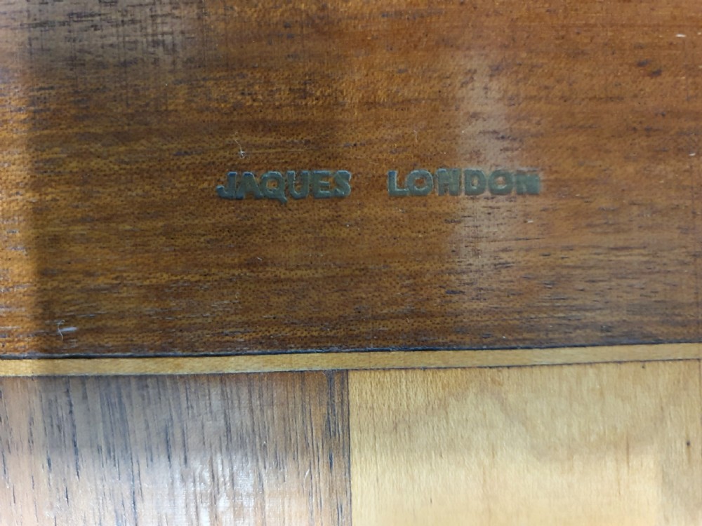 Early 20th century chess board made by Jacks of London with chess set View VI