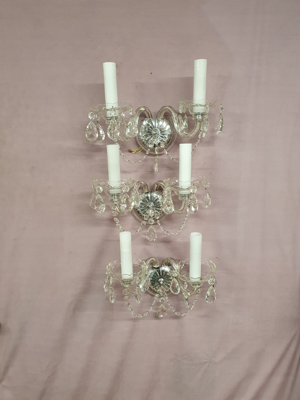 Three early 20th century wall lights in glass