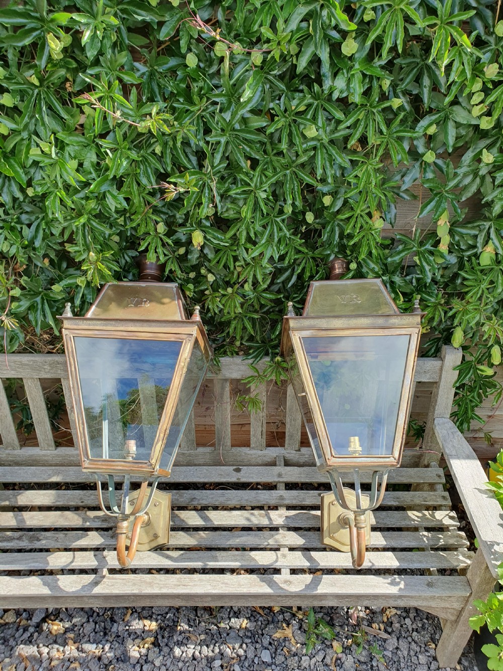 Pair of outside brass porch lights with the letters V R