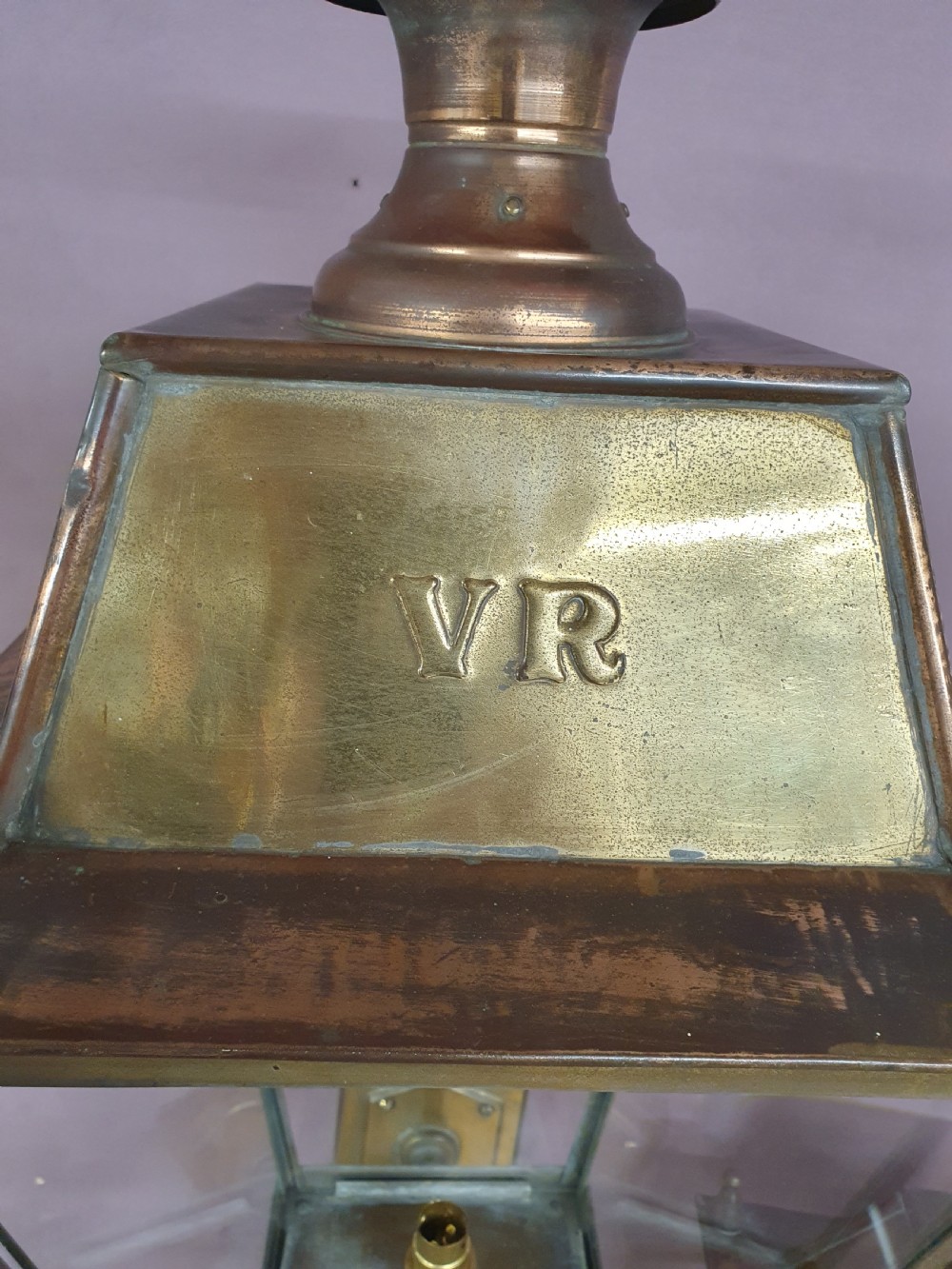 Pair of outside brass porch lights with the letters V R View IV
