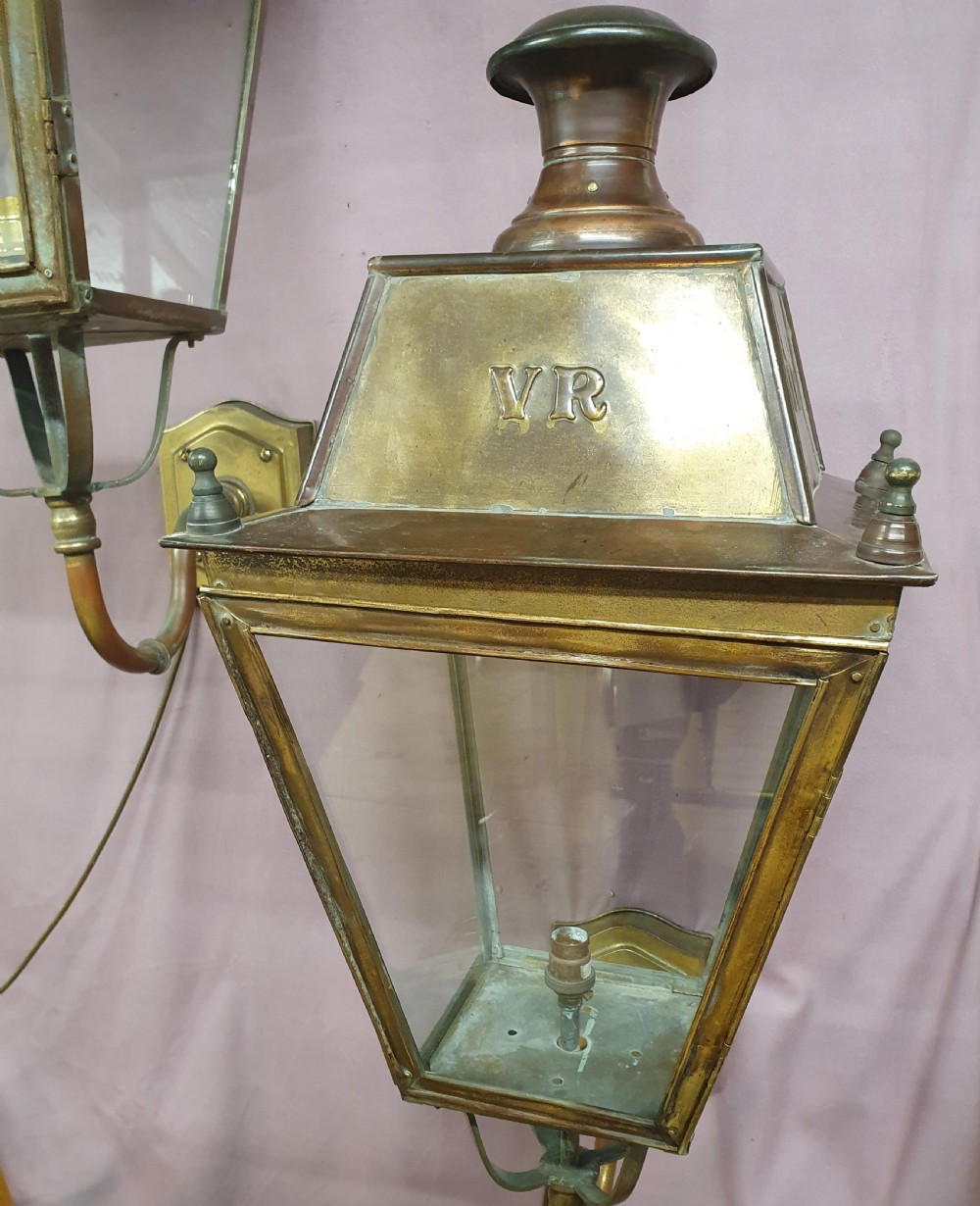 Pair of outside brass porch lights with the letters V R View V