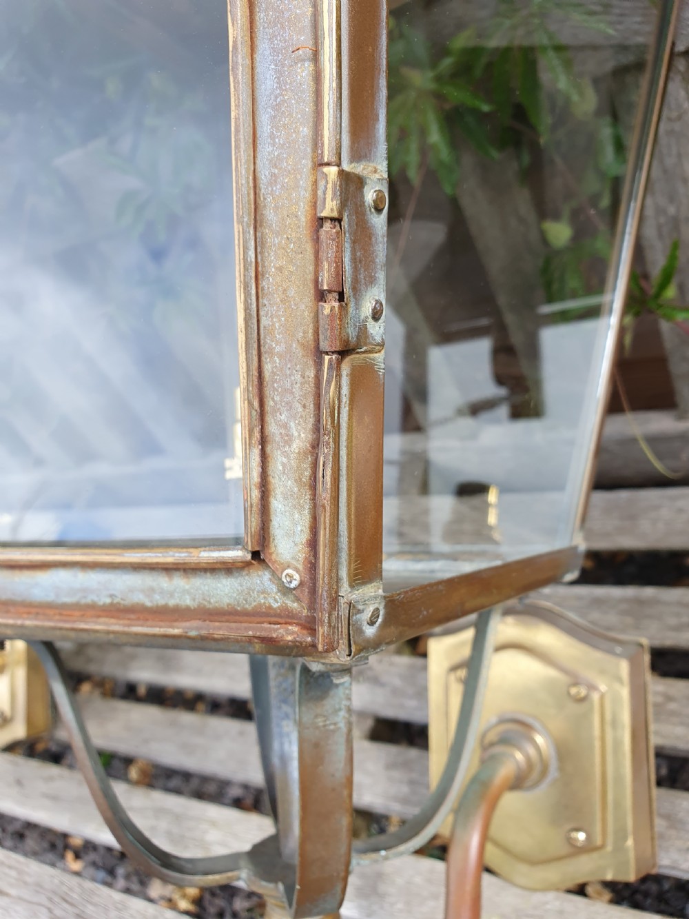 Pair of outside brass porch lights with the letters V R View VII