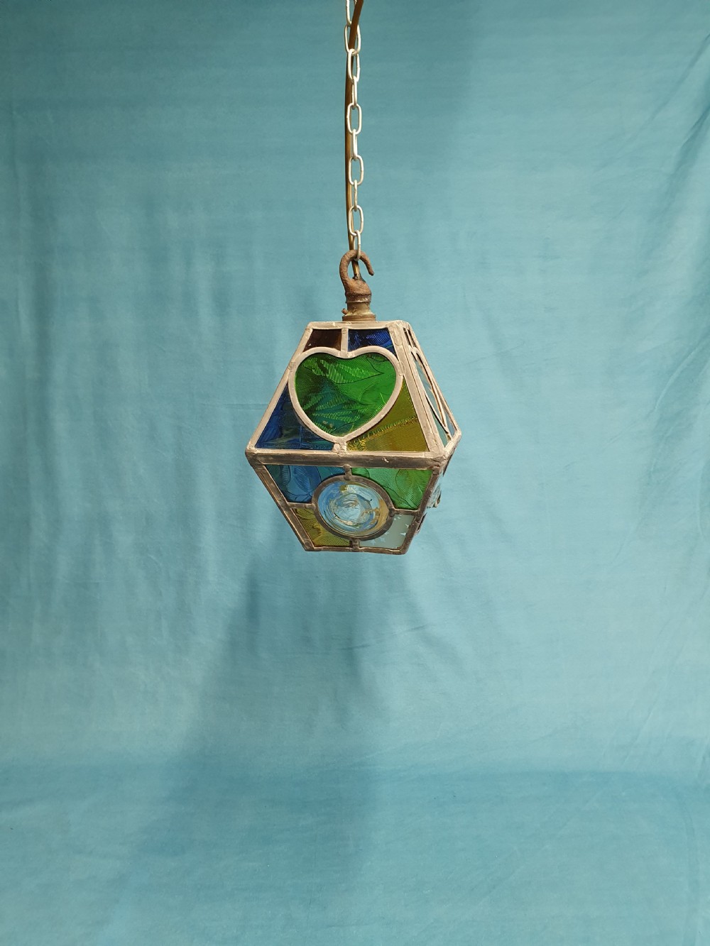 Arts and craft porch light with a heart.
