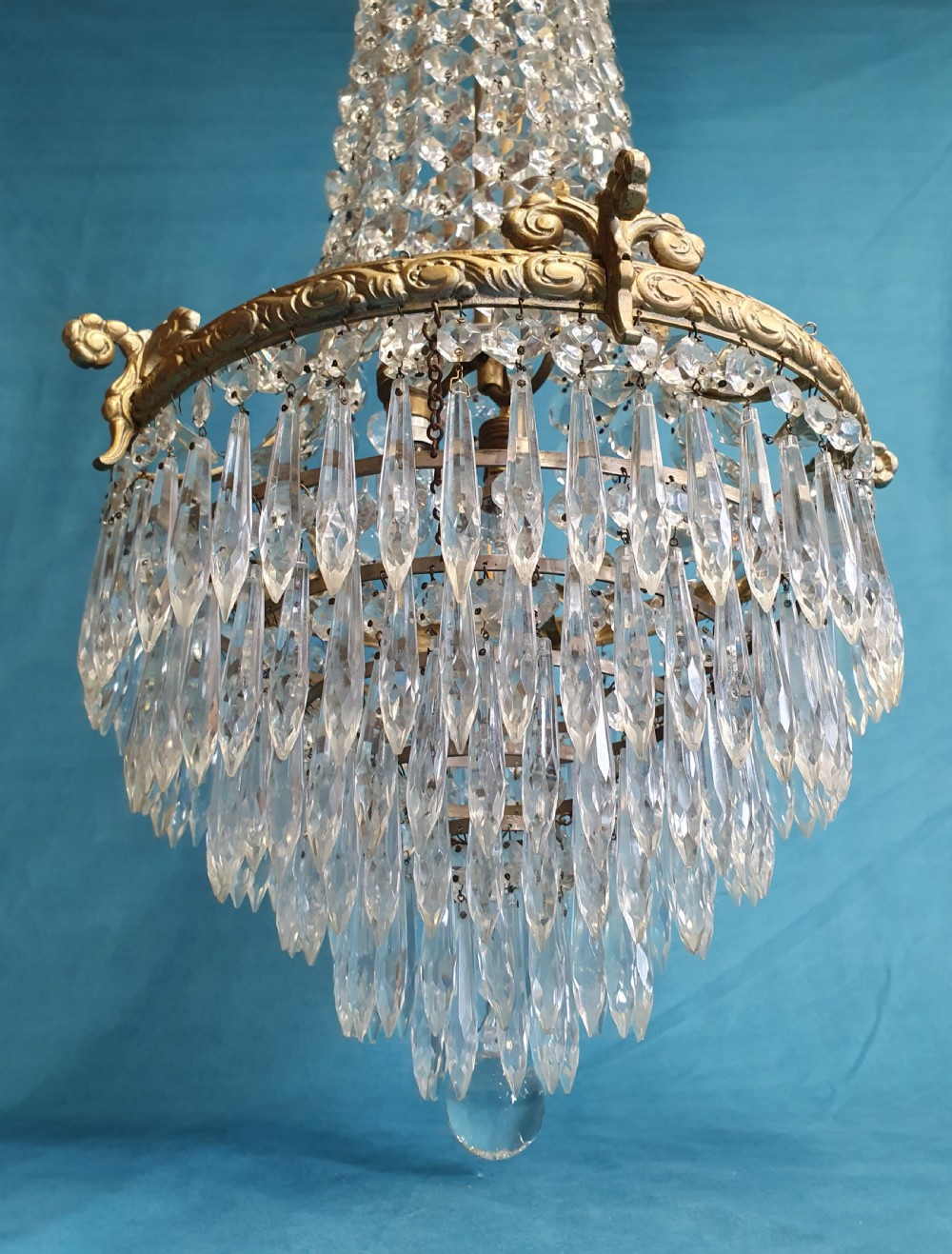 Elegant tall chandelier with six layers of spikes to the bottom View III
