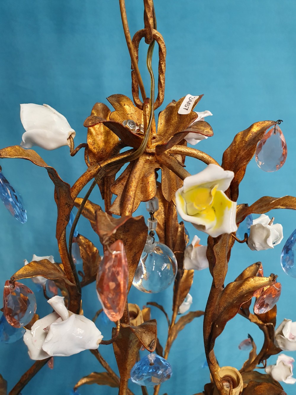 A French gilt metal chandelier and two matching two-arm wall sconces decorated with multi-coloured porcelain flowers and tinted crystal drops. View III
