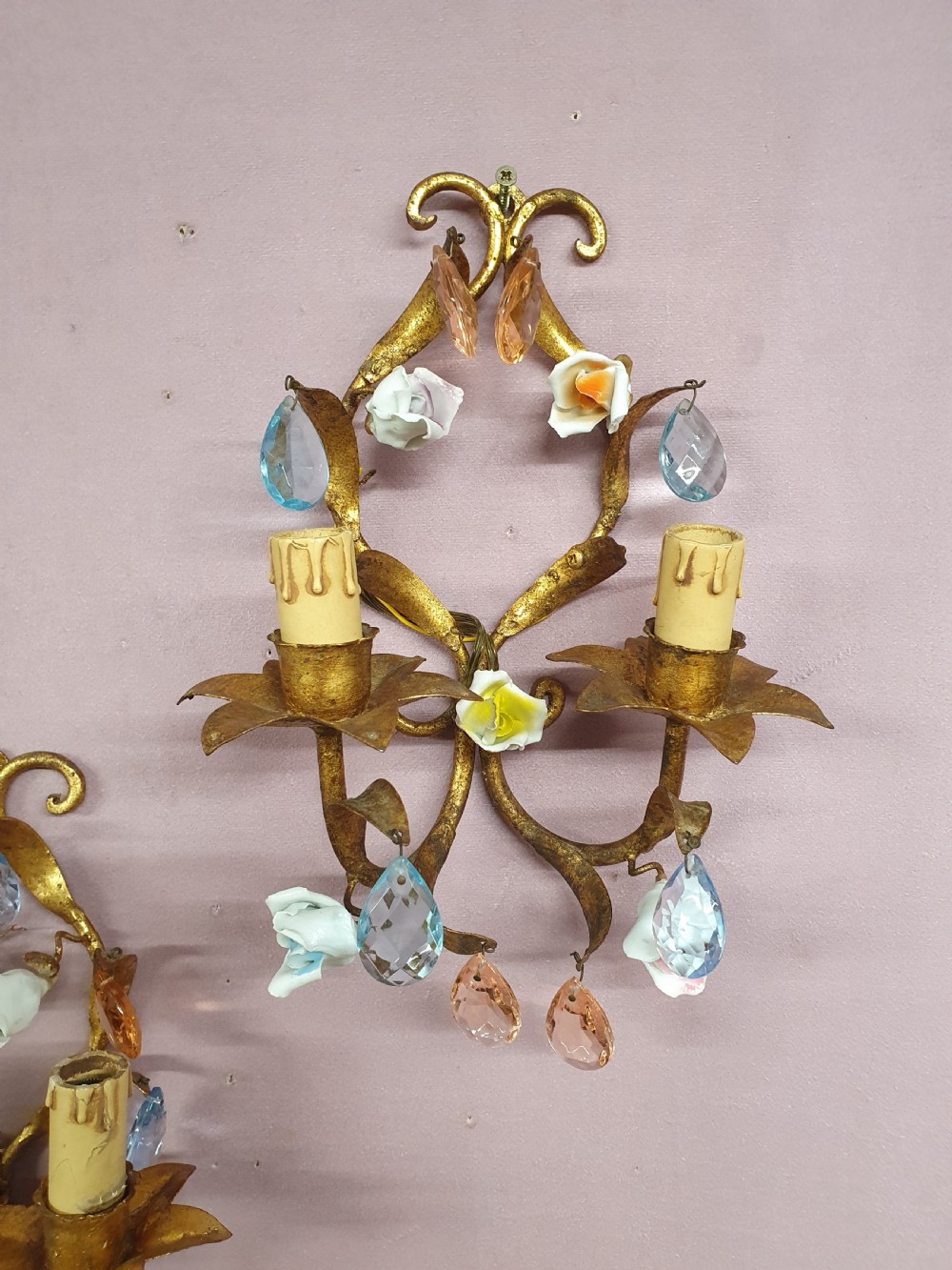 A French gilt metal chandelier and two matching two-arm wall sconces decorated with multi-coloured porcelain flowers and tinted crystal drops. View IX