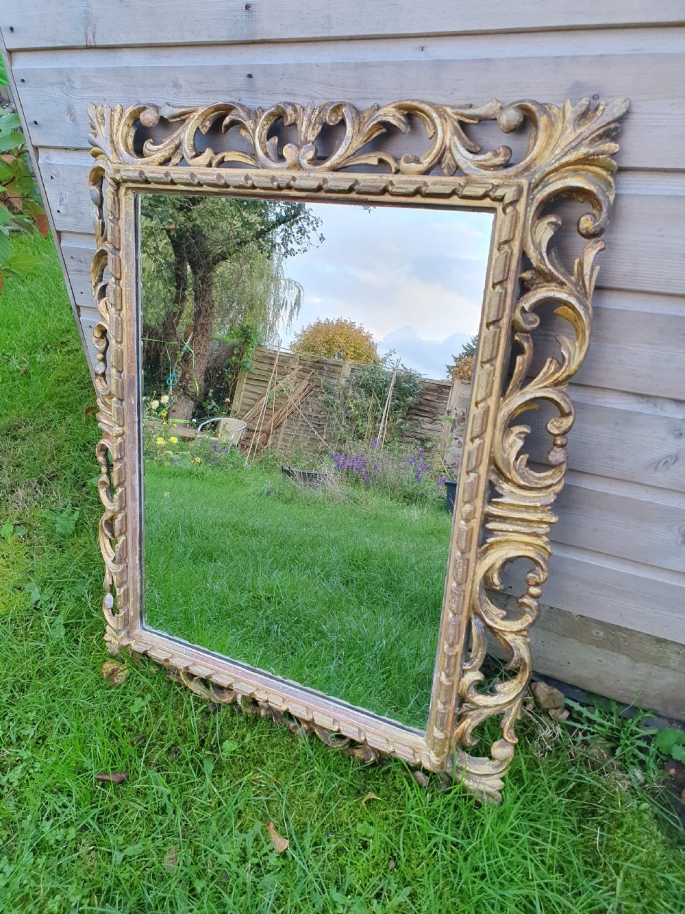 19th-century gilt mirror in carved wood