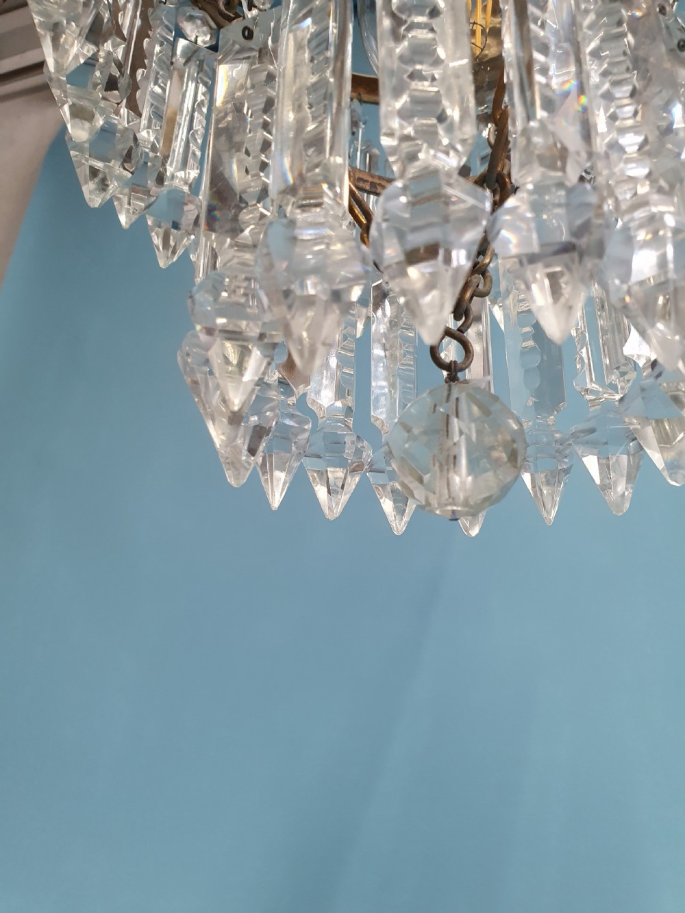 Chandelier with cherub of decoration to the top decorated with two tiers of lustres. 10