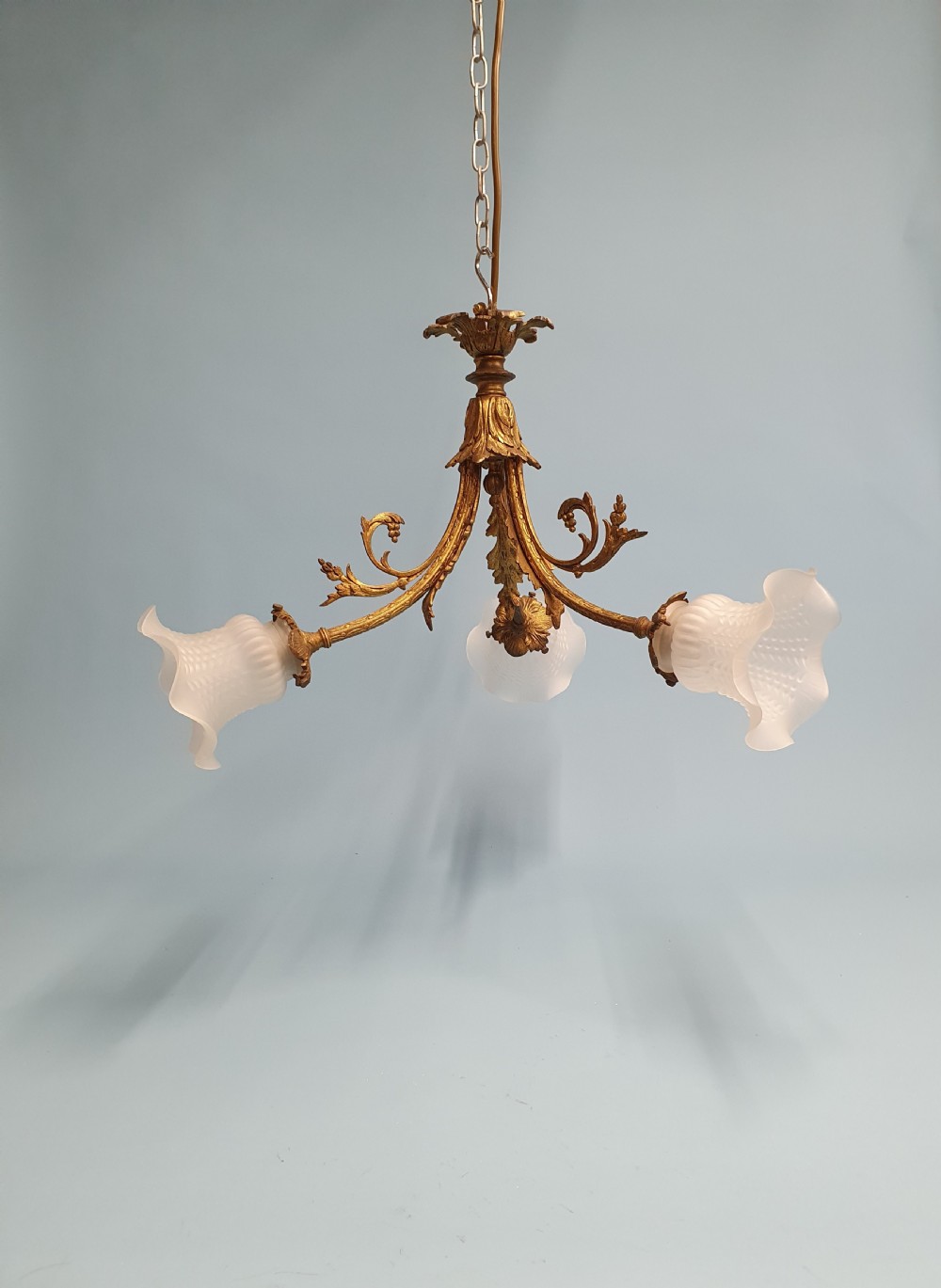 Early 20th century guilt brass chandelier with three glass shades