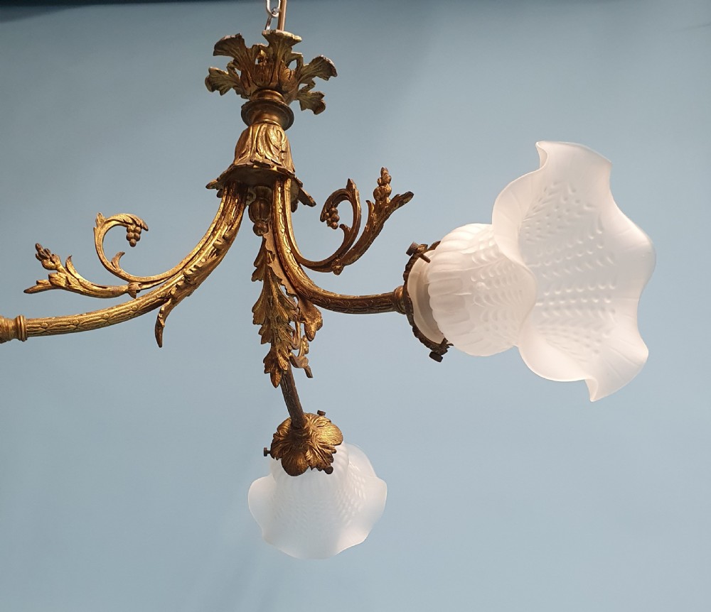 Early 20th century guilt brass chandelier with three glass shades View VI
