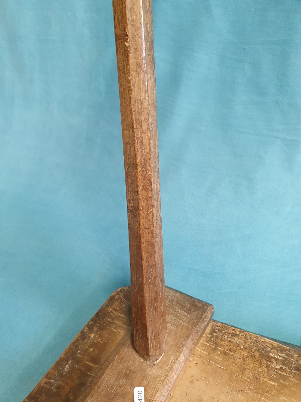 A late 19th-century walnut stick stool featuring a rectangular thick wooden seat raised on four round splayed legs. View III