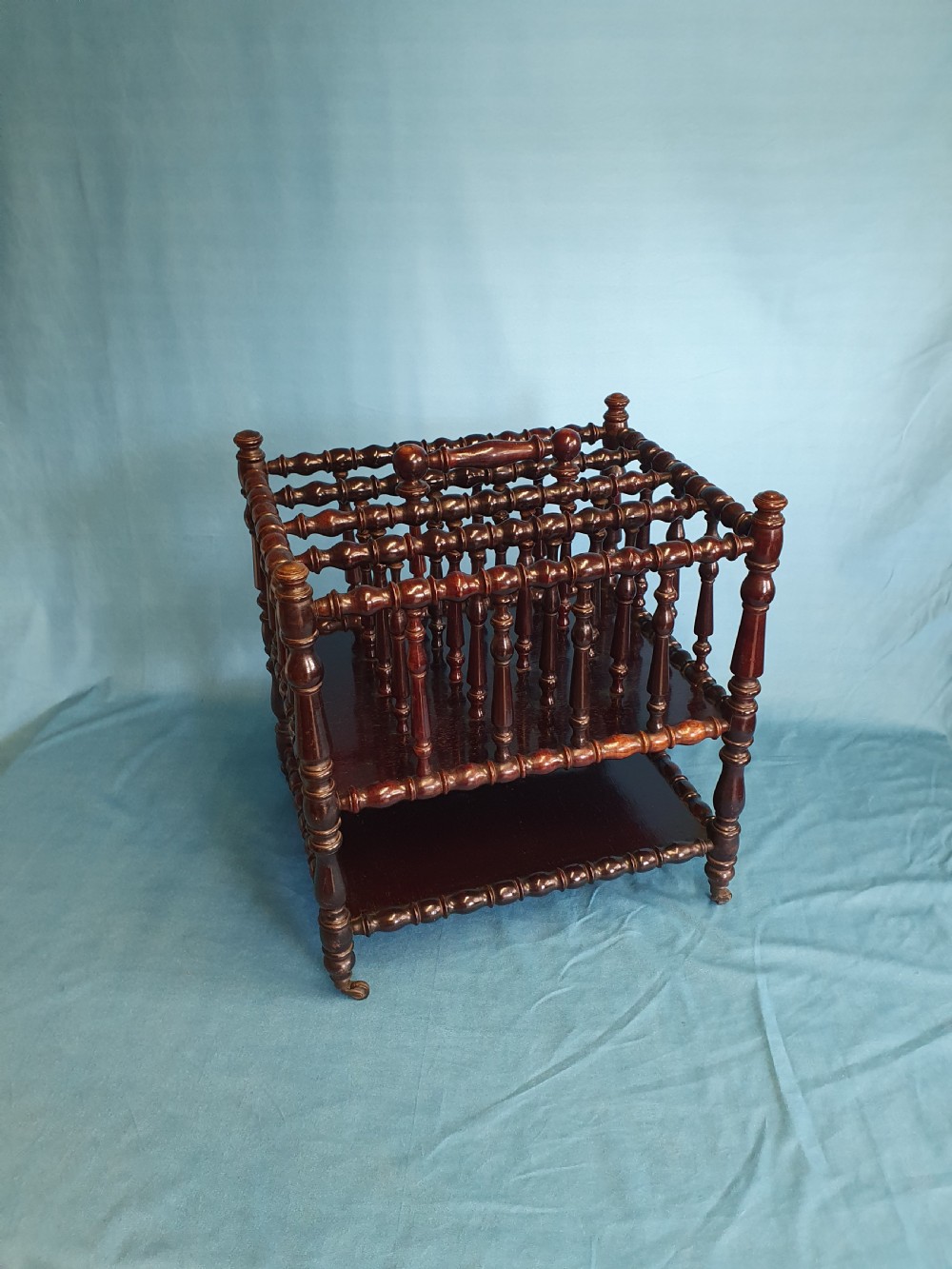 Mid 19th century Bobbin turned Rosewood Canterbury with shelf.