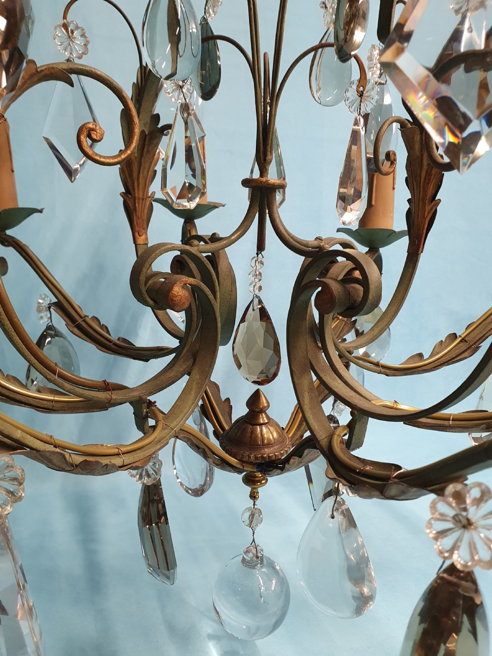 An early twentieth-century French green steel six-light chandelier adorned with faceted crystal glass drops and pleated white fabric shades. View V