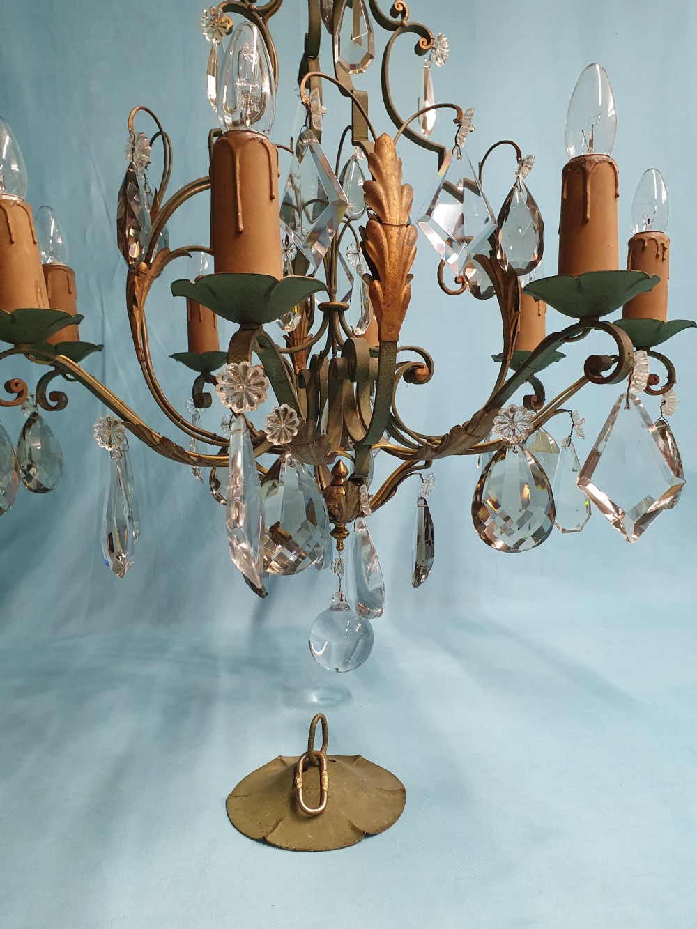 An early twentieth-century French green steel six-light chandelier adorned with faceted crystal glass drops and pleated white fabric shades. View VI