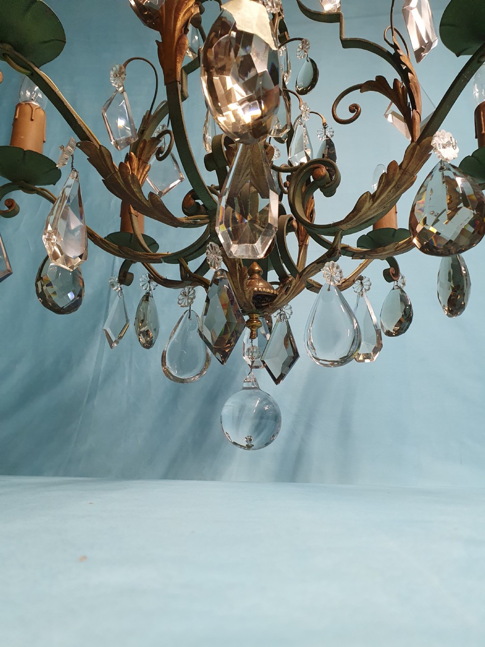 An early twentieth-century French green steel six-light chandelier adorned with faceted crystal glass drops and pleated white fabric shades. View VII