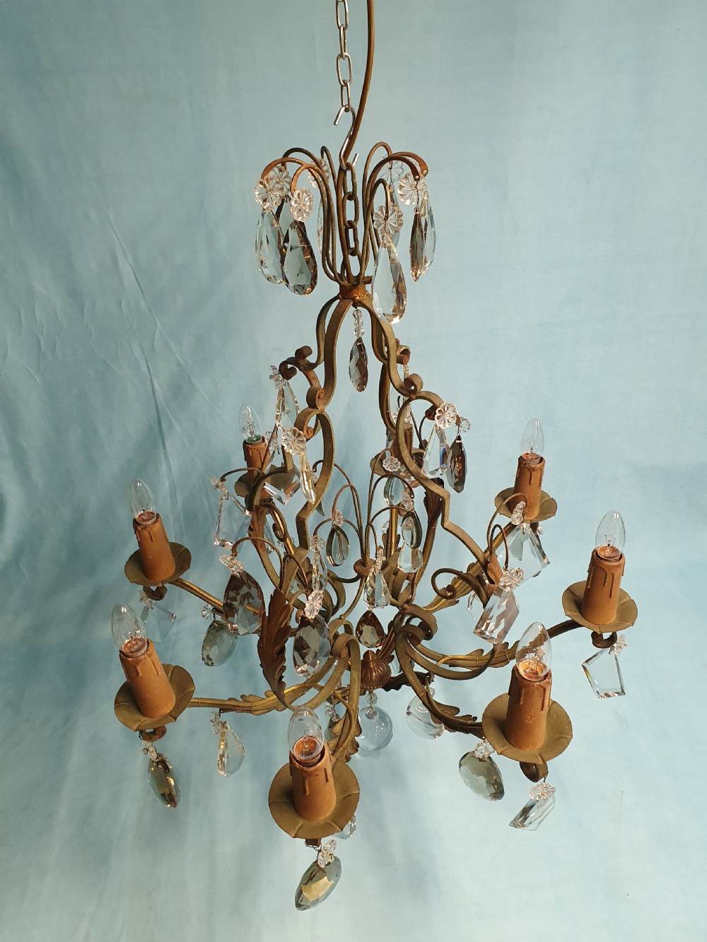 An early twentieth-century French green steel six-light chandelier adorned with faceted crystal glass drops and pleated white fabric shades. View VIII