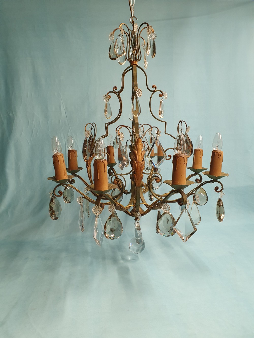 An early twentieth-century French green steel six-light chandelier adorned with faceted crystal glass drops and pleated white fabric shades. View IX