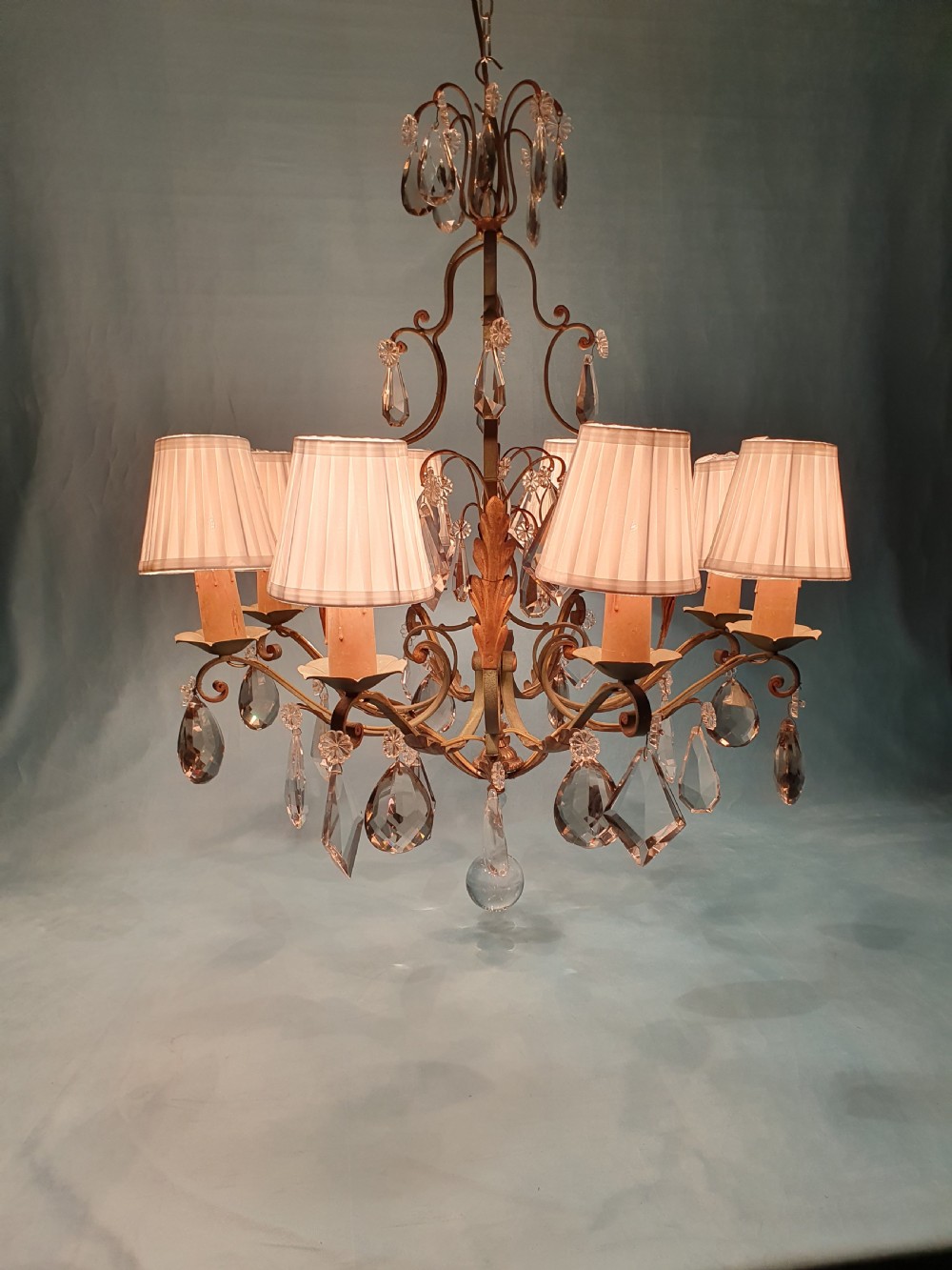 An early twentieth-century French green steel six-light chandelier adorned with faceted crystal glass drops and pleated white fabric shades. View XI