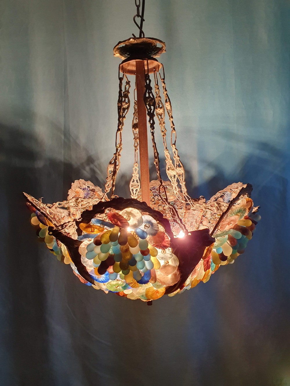 An early 20th-century Continental ceiling chandelier featuring a brass frame decorated with colourful opaque glass grapes and flowers. View IV