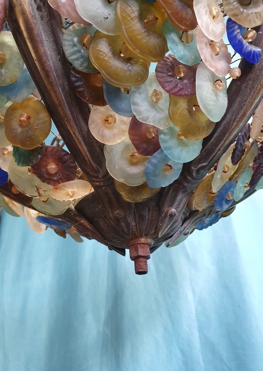 An early 20th-century Continental ceiling chandelier featuring a brass frame decorated with colourful opaque glass grapes and flowers. View IX
