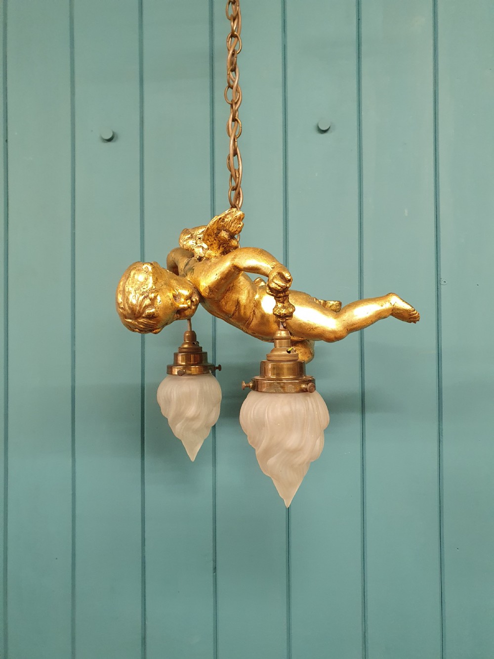 Nice quality gilt cherub with New York flames hanging from the arms 12