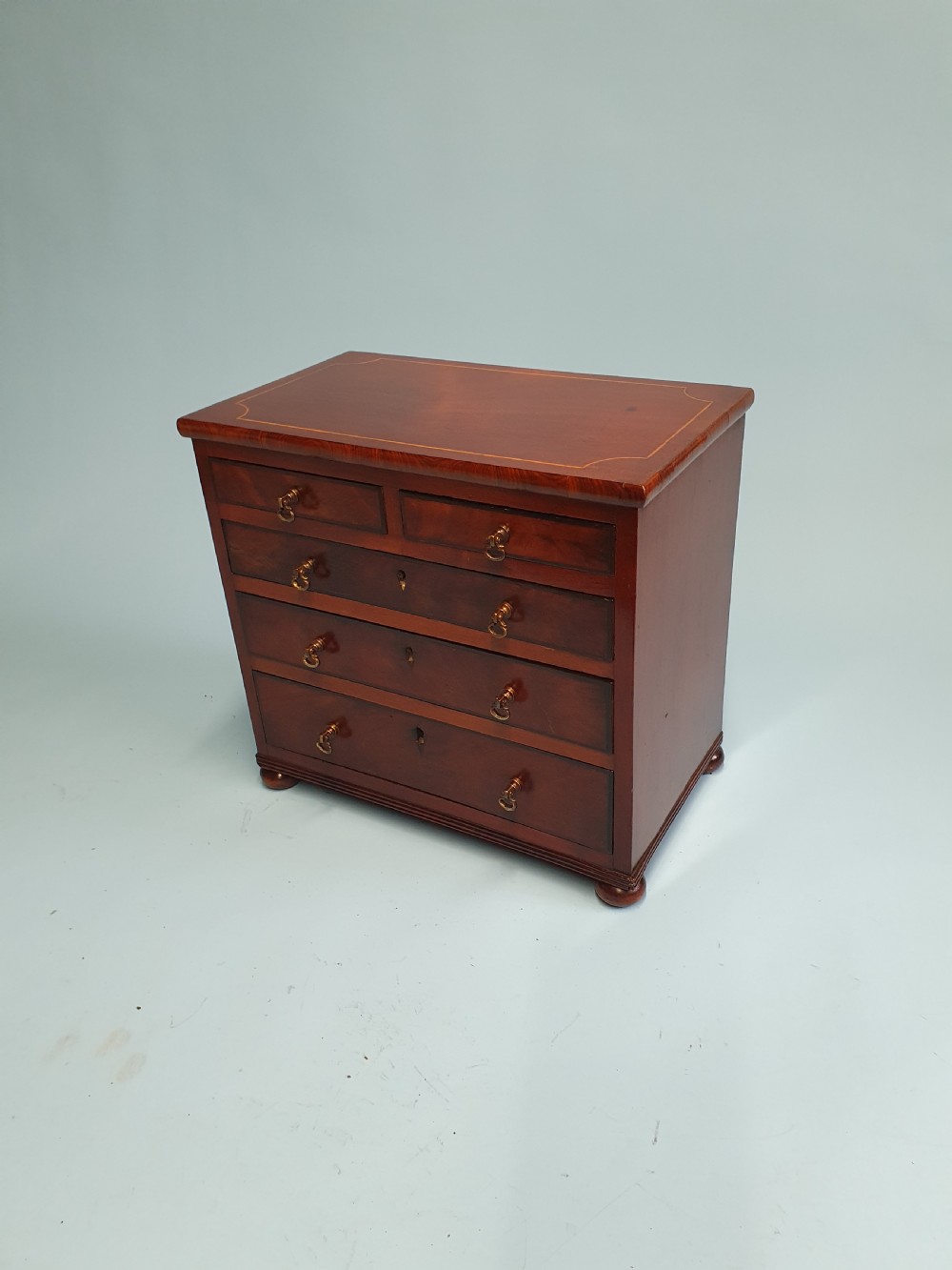 Early 19th century miniature 2/3 mahogany chest of drawers dated 1824.